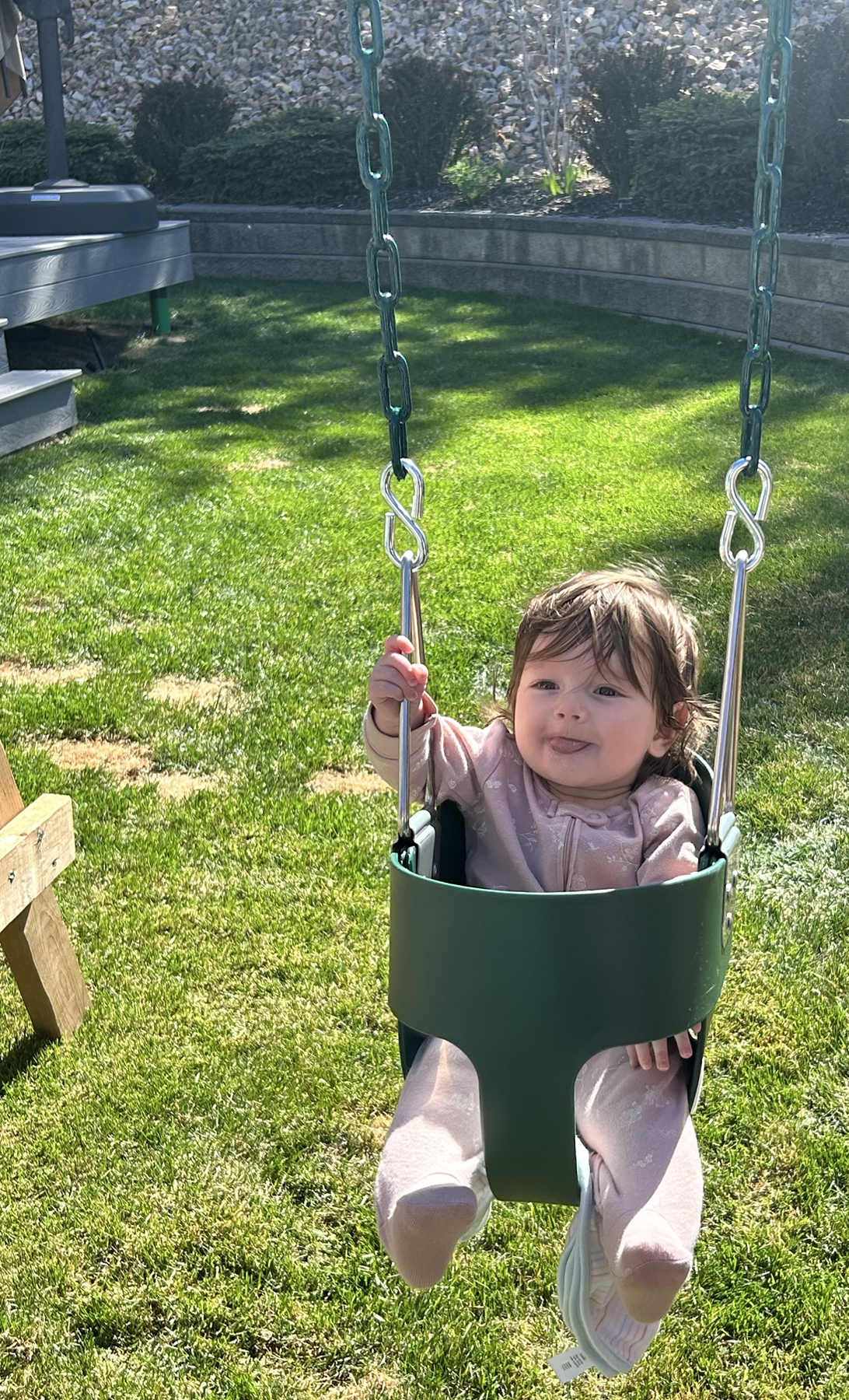 My niece smiling in the swing